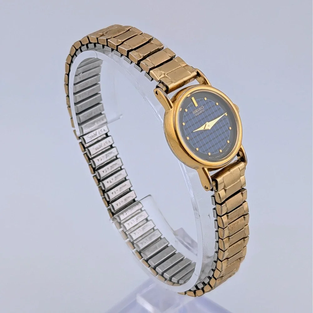 Vintage Seiko 1N00-0F60 Blue Woven Grid Textured Dial Gold Tone Watch 20mm